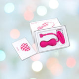 The OhMiBod Lovelife Krush Smart Kegel Fitness - Pink set by OhMiBod features two devices in heart-themed packaging, displayed on a soft pastel bokeh background.