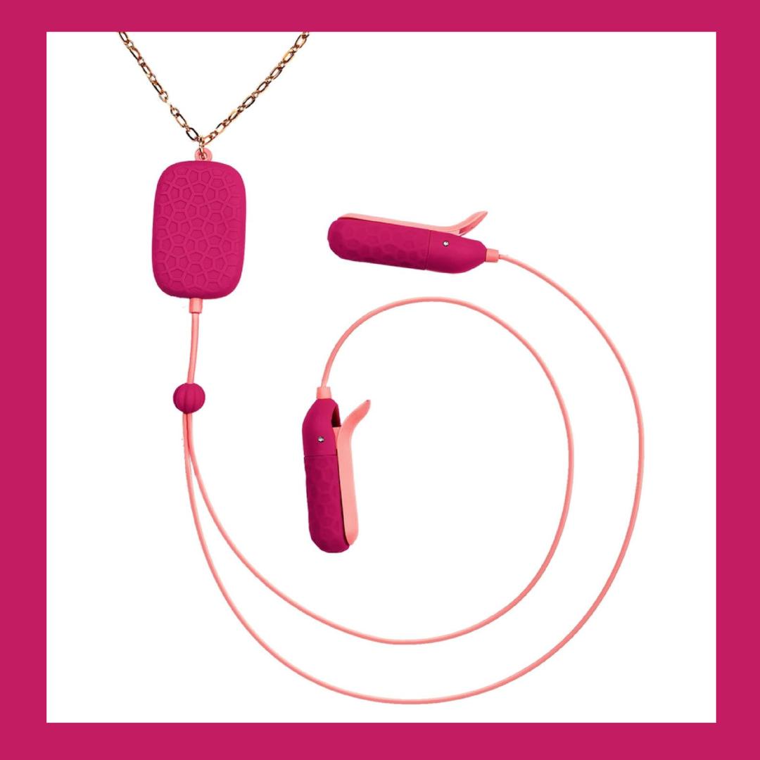 The OhMiBod Sphinx Bluetooth App-controlled Nipple Clamps in Raspberry by OhMiBod feature a textured pink surface, gold chain, and earbud-like ends connected by a pink cord, offering seamless Bluetooth app control. Displayed on white with a pink border.