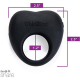 The OhMiBod Lovelife Share Couple’s Ring Vibe - Black is a silicone ring embossed with "OhMiBod" in a heart-like shape, perfect for shared adventures. Measuring 2.5 by 2.5 inches with an inner circle diameter of 1.2 inches, it's designed for creating meaningful connections. The image features a purple measurement guide for reference.