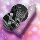 Two ONE Flex Graphene Ultra-Thin Condom packets, featuring a black and silver design, and an unrolled condom are displayed against a pink and purple bokeh background with soft, glowing lights.