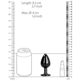 The Shots Ouch! Large Metal Butt Plug – Gunmetal with Diamond Base is displayed beside a soda can and lipstick for scale, with rulers showing its length as 9.3 cm (3.7 in) and max diameter as 4 cm (1.6 in).