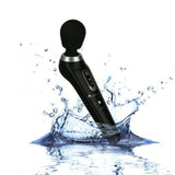 The PalmPower Extreme Wand Massager - Black by BMS, with a round head, is shown splashing into water against a white background to highlight its waterproof design.