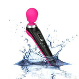 The BMS PalmPower Extreme Wand Massager - Pink features a black and pink design with a rounded silicone head, shown splashing into water to emphasize its waterproof and rechargeable handheld wand construction.