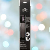 A product box for the CalExotics Peak Rechargeable Penis Pump displays product images, specs, and features on the front with a blurred, colorful background.