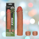 The image features the CalExotics Performance Maxx Liquid Silicone Extension System - Brown, its "Performance Maxx" packaging, and two cap-like attachments, all displayed against a colorful, blurred background.