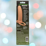 The Performance Maxx Rechargeable Thick Dual Penetrator - Ivory by CalExotics comes in a package displaying the toy, USB rechargeability, silicone construction, and multiple vibration functions against a blurred backdrop.
