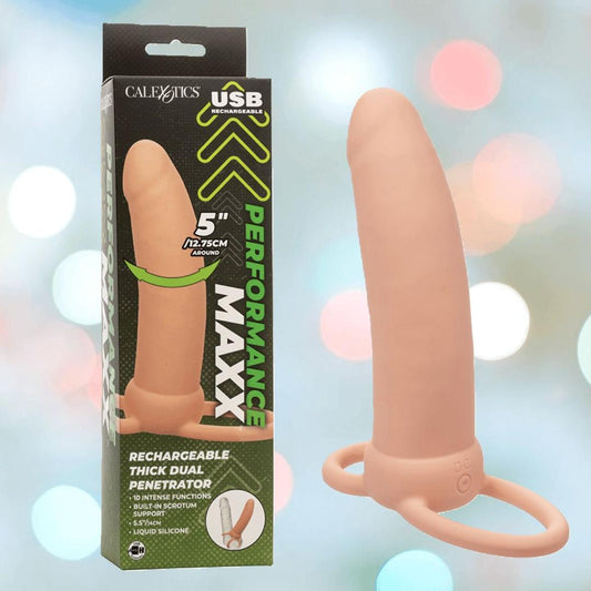 The CalExotics Performance Maxx Rechargeable Thick Dual Penetrator - Ivory, a silicone probe with a ringed base, is shown beside its packaging featuring 10 intensity modes and USB recharging for powerful double penetration play. 1080