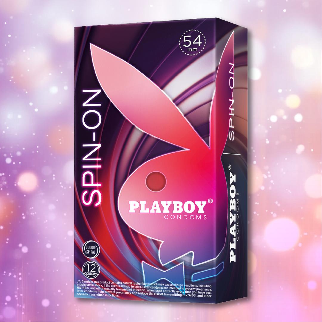 A box of Playboy Condoms - Spin-On Double Spiral by Playboy, featuring "54 mm," "12," and premium lubricated condoms with double spiral texture, set against a colorful abstract background with a large pink bunny logo.