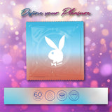 A condom wrapper with the Playboy bunny logo sits on a pink-purple bokeh background. Text above reads "Define your Pleasure." Icons show 60mm width, lubrication, layered, and latex—featuring Playboy Condoms - Ultra Light XL Extra Large.