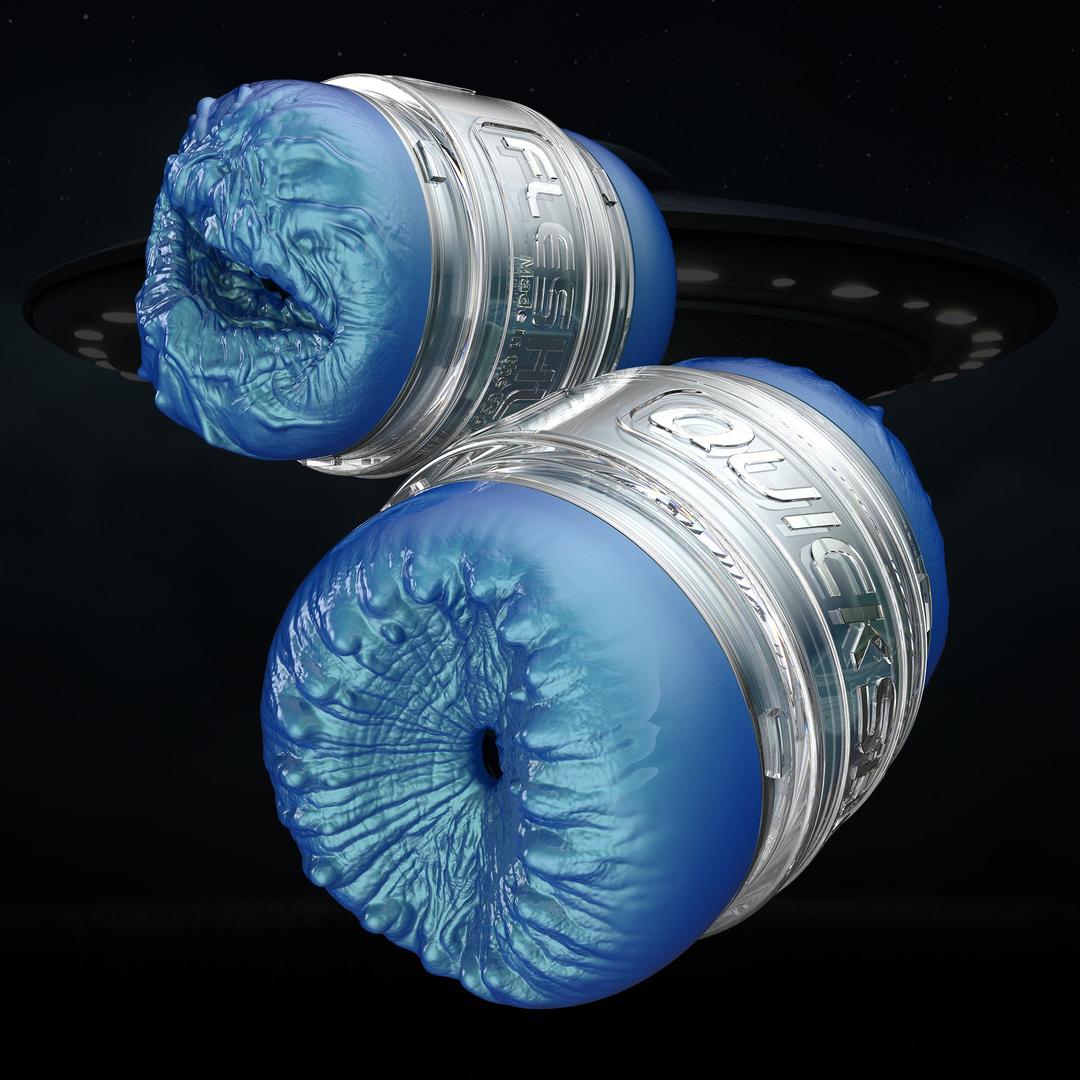 Two translucent blue and silver cylinders with textured, organic ends float before a dark backdrop—mirroring the travel-friendly dual-entry sleeve of the Fleshlight Quickshot Alien Blue Male Masturbator: Mouth & Butt by Fleshlight.