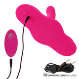The CalExotics Triple Rider Remote Control Ecstasy Rumbler, shown in pink with an attached remote and dual USB charging cord on a white background, is made from body-safe silicone. Text: "DUAL USB CHARGING CORD INCLUDED.