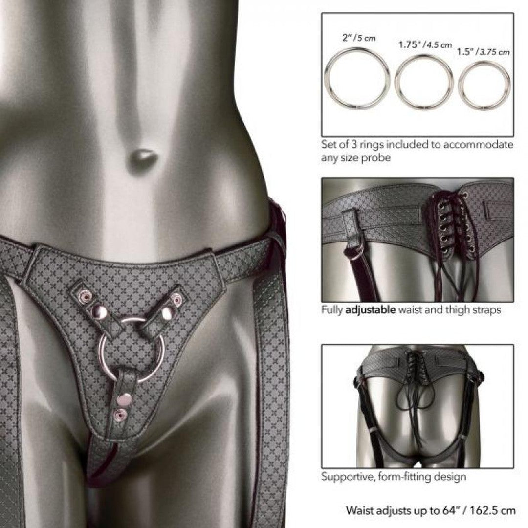 A mannequin displays the CalExotics Her Royal Harness The Regal Queen Pewter, which boasts adjustable waist and thigh straps embellished with rings. It also features three metal rings of different sizes for those interested in premium probe play. This form-fitting design can adjust to a waist size of up to 64 inches (162.5 cm), offering a regal custom fit.