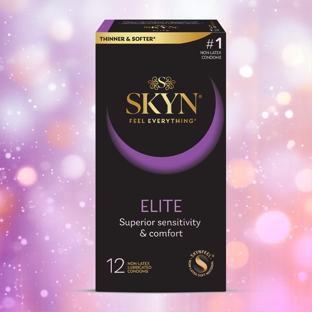 A 12-count box of LifeStyles SKYN Elite Condoms (Latex-Free), with “Superior sensitivity & comfort” and “Thinner & softer” on the packaging, is shown against a pink and purple bokeh background.