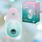 A mint pink Satisfyer Pixie Dust Air-Pulse Clitoral Stimulator from the Satisfyer brand is showcased alongside its packaging. The backdrop features a soft, multicolored bokeh effect, highlighting its appeal for enhanced clitoral stimulation.