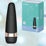 The Satisfyer Pro 3+ Air Pulse Stimulator by Satisfyer is presented with its unique conical silhouette in a bold black and gold design, next to its sophisticated light blue packaging embellished with line art. The scene is set against a backdrop of gentle pastel gradient hues.