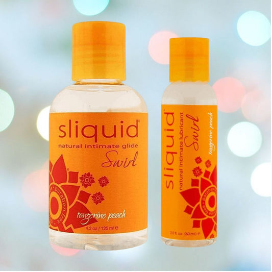 Two bottles of Sliquid Swirl's "Tangerine Peach" flavored lubricant by Sliquid, featuring a refreshing tangerine peach scent. The orange bottles, decorated with floral patterns, consist of one 4 oz and one 2 oz bottle set against a gentle, softly blurred background. 1080