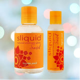 Two bottles of Sliquid Swirl's "Tangerine Peach" flavored lubricant by Sliquid, featuring a refreshing tangerine peach scent. The orange bottles, decorated with floral patterns, consist of one 4 oz and one 2 oz bottle set against a gentle, softly blurred background.