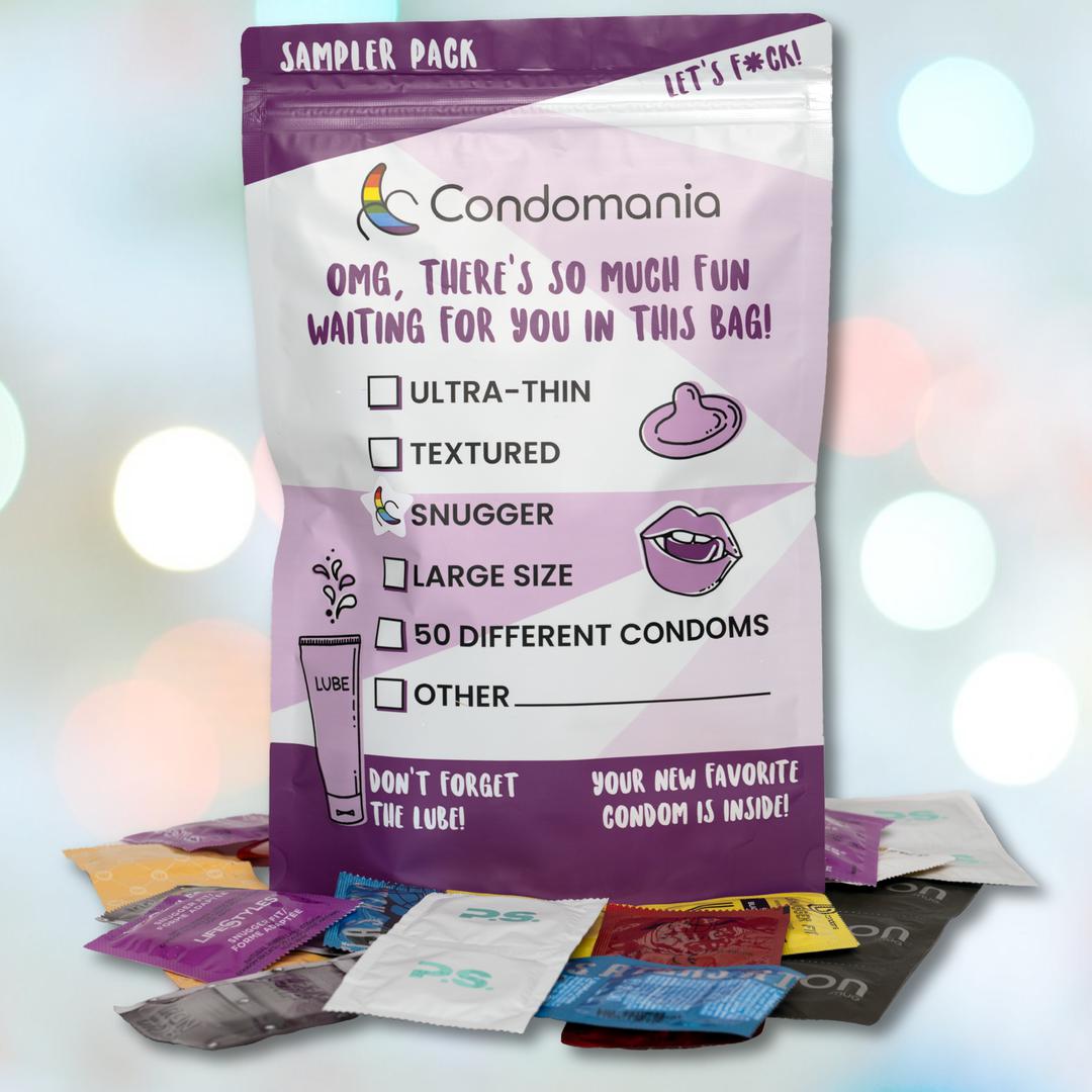 The "Snugger Fitting Condom Sampler" by Condomania is displayed with scattered packages, highlighting options like ultra-thin, textured, snugger-fitting condoms, large size, and others. A total of 50 variations are available along with a lubricant tube for enhanced comfort and pleasure.