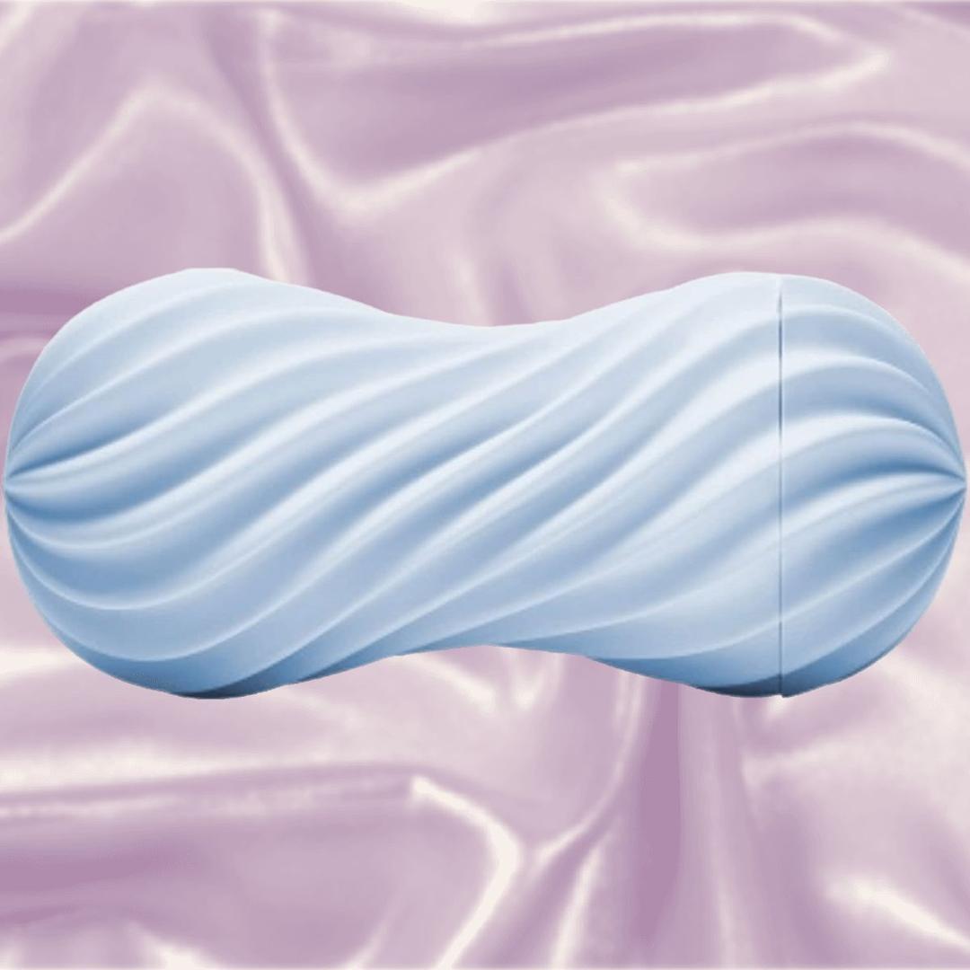The Tenga Flex Bubbly Blue is a light blue, cylindrical pleasure sleeve with wavy ridges, shown on pastel pink satin to showcase its reusable design and unique suction from the trusted Tenga brand.