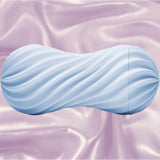 The Tenga Flex Bubbly Blue is a light blue, cylindrical pleasure sleeve with wavy ridges, shown on pastel pink satin to showcase its reusable design and unique suction from the trusted Tenga brand.