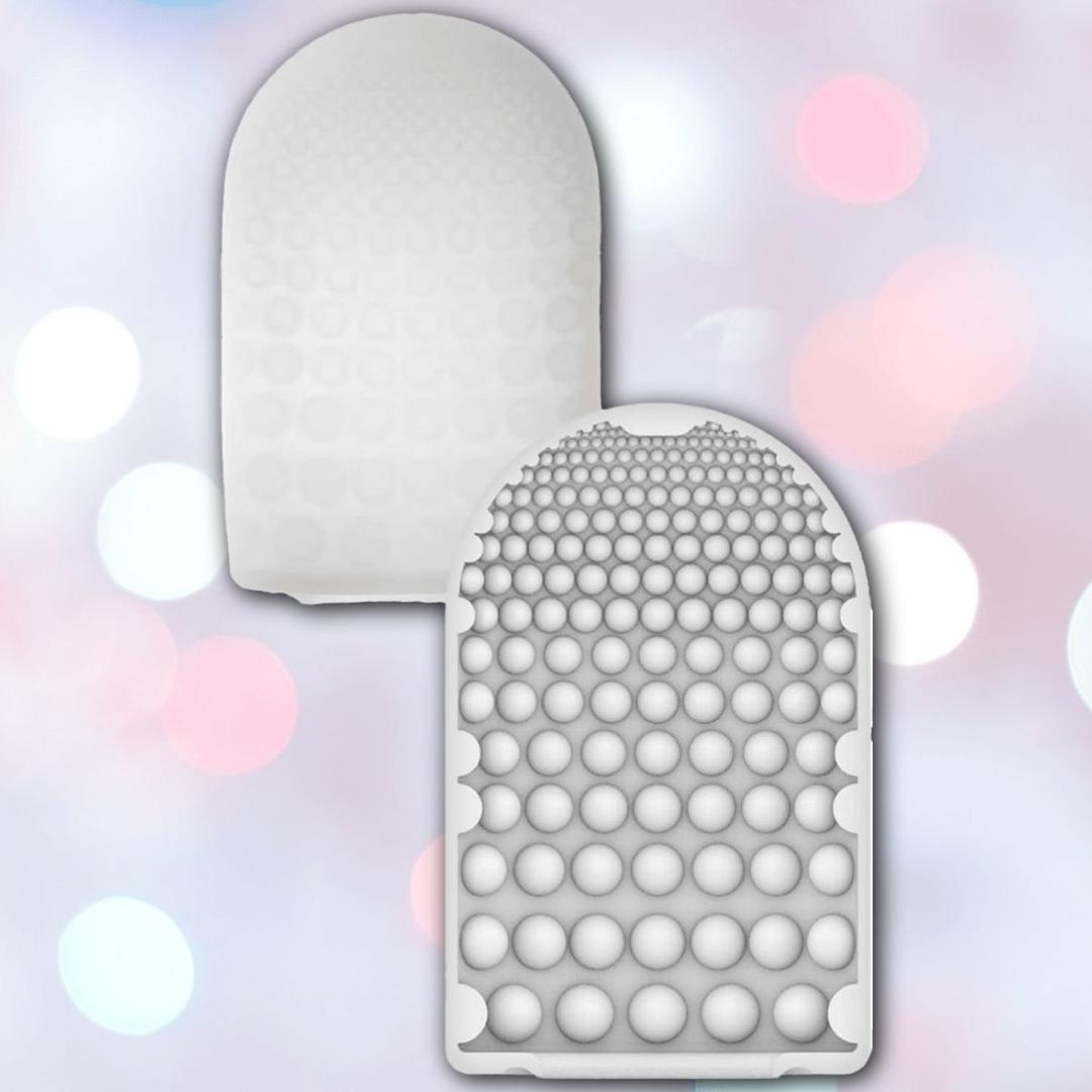 Two TENGA Pocket Click Ball Disposable Textured Male Masturbators by Tenga are shown against a soft pastel background. Their stretchy silicone design and raised bumps offer pocket-sized pleasure, with one displayed face up and the other face down.