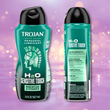 Two teal bottles of Trojan H2O Sensitive Touch with Aloe Lubricant (5.5oz) by Trojan, with visible product details and ingredients, displayed against a pink background accented with soft bokeh lighting effects.