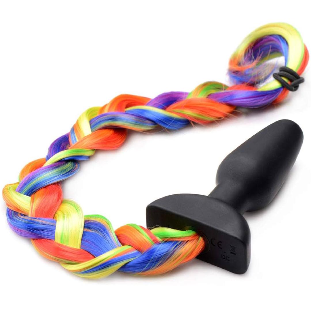 The Tailz Vibrating Rainbow Tail Anal Plug by Tailz features a black silicone plug with a vibrant, braided rainbow tail and remote control—ideal for pony play enthusiasts seeking colorful excitement.