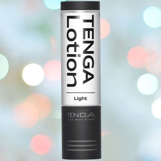 A cylindrical bottle of Tenga Hole Lotion Light Lubricant is showcased against a bokeh background featuring circular light spots. The label includes bold black text, and the bottle's primary white and black design emphasizes its water-based lubricant formula, specifically crafted for use with Tenga toys. 1080