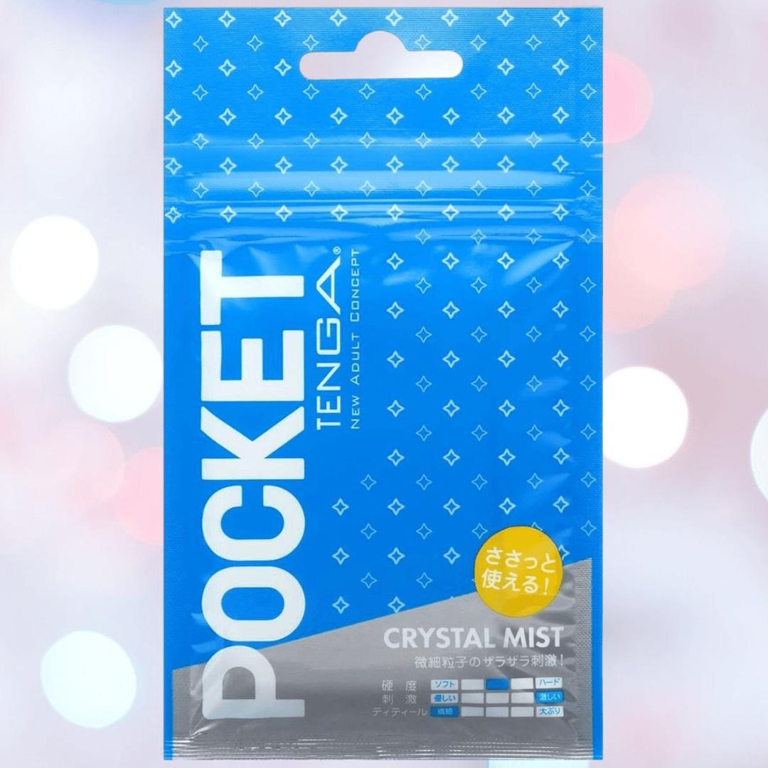A blue TENGA POCKET Crystal Mist packet features white geometric designs and text. A yellow circle with Japanese lettering and "CRYSTAL MIST" spotlights this disposable micro-nub stroker by Tenga, promising cool, refreshing sensations.