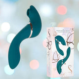 The Monarch Swan - Teal by BMS, a curved G-spot vibrator, is shown beside its white box featuring butterfly art and a product image. The softly blurred background glows with pastel lights.