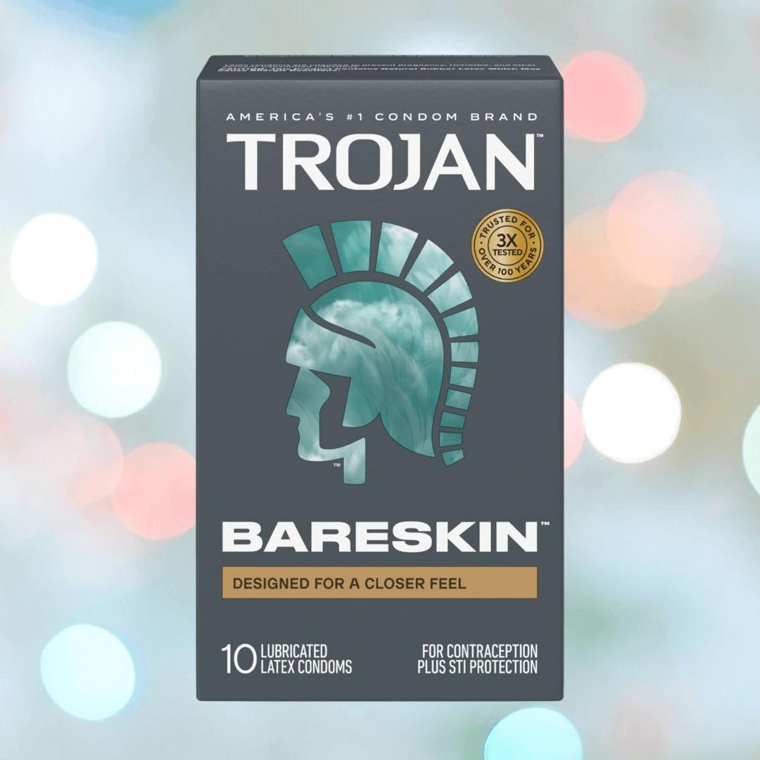 A box of Trojan BareSkin Ultra Thin Condoms by Trojan is shown, featuring a teal helmet logo, the phrase "Designed for a closer feel," and highlighting STI protection. The box includes 10 ultra-thin condoms made with some of the thinnest latex available.