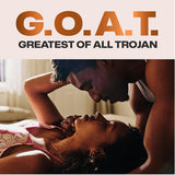 A couple lies close on a bed, gazing into each other's eyes. Bold text reads "G.O.A.T. Greatest Of All Trojan," spotlighting Trojan G.O.A.T. Non-Latex Lubricated Condoms for unforgettable comfort and connection.