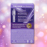 A purple Trojan Her Pleasure Sensations Ribbed Condoms box with details about its classic reservoir tip, ribbed texture for extra sensation, and silky lubricant stands out against a soft pink bokeh background.