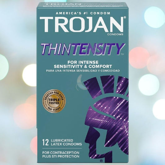 A package of Trojan's Thintensity Condoms prominently displays the brand's logo and guarantees heightened sensitivity and comfort. These condoms feature an ultra-smooth lubricant and include 12 lubricated latex condoms, providing dependable protection against STIs and serving as an effective contraceptive. 1080