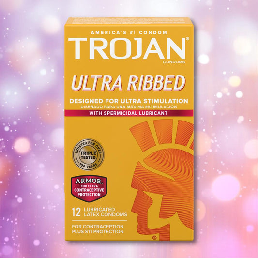 A box of Trojan Ultra Ribbed Armor Condoms by Trojan features orange and yellow packaging with a Roman helmet, highlighting ultra stimulation and protection on a pink and purple bokeh background. 1080