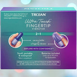 A vibrant purple and teal box presents the Trojan Ultra Touch Bullet and Massager, highlighting its versatile 2-in-1 design. This compact, portable, and waterproof device supports sexual health and comes with batteries included. The image features two interchangeable purple attachments for customized pleasure.