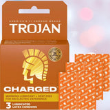 A box of Trojan Charged Deep-Ribbed Condoms by Trojan with “warming lubricant + deep ribs” text, shown alongside three individually wrapped condoms on a light pink background.