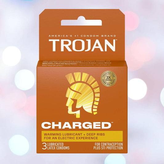 A bright orange box of Trojan Charged Deep-Ribbed Condoms with a gladiator helmet logo, featuring warming lube, deep ribs for extra sensation, and 3 lubricated latex condoms from Trojan for contraception and STI protection. 1080