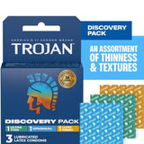 The Trojan Discovery Pack (3 Types of Condoms) by Trojan is shown, featuring Ultra Thin, Original, and Ultra Ribbed condoms. The box highlights "An assortment of thinness & textures" with blue, orange, and green wrappers displayed.