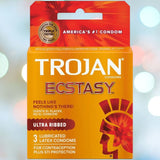 A packaged box of Trojan Ultra Ribbed Ecstasy Condoms, from the brand Trojan, showcases an orange and red design, emphasizing "America's #1 Condom" and "Feels Like Nothing's There!" The package includes 3 lubricated latex condoms with premium lubricant for contraception and STI protection.