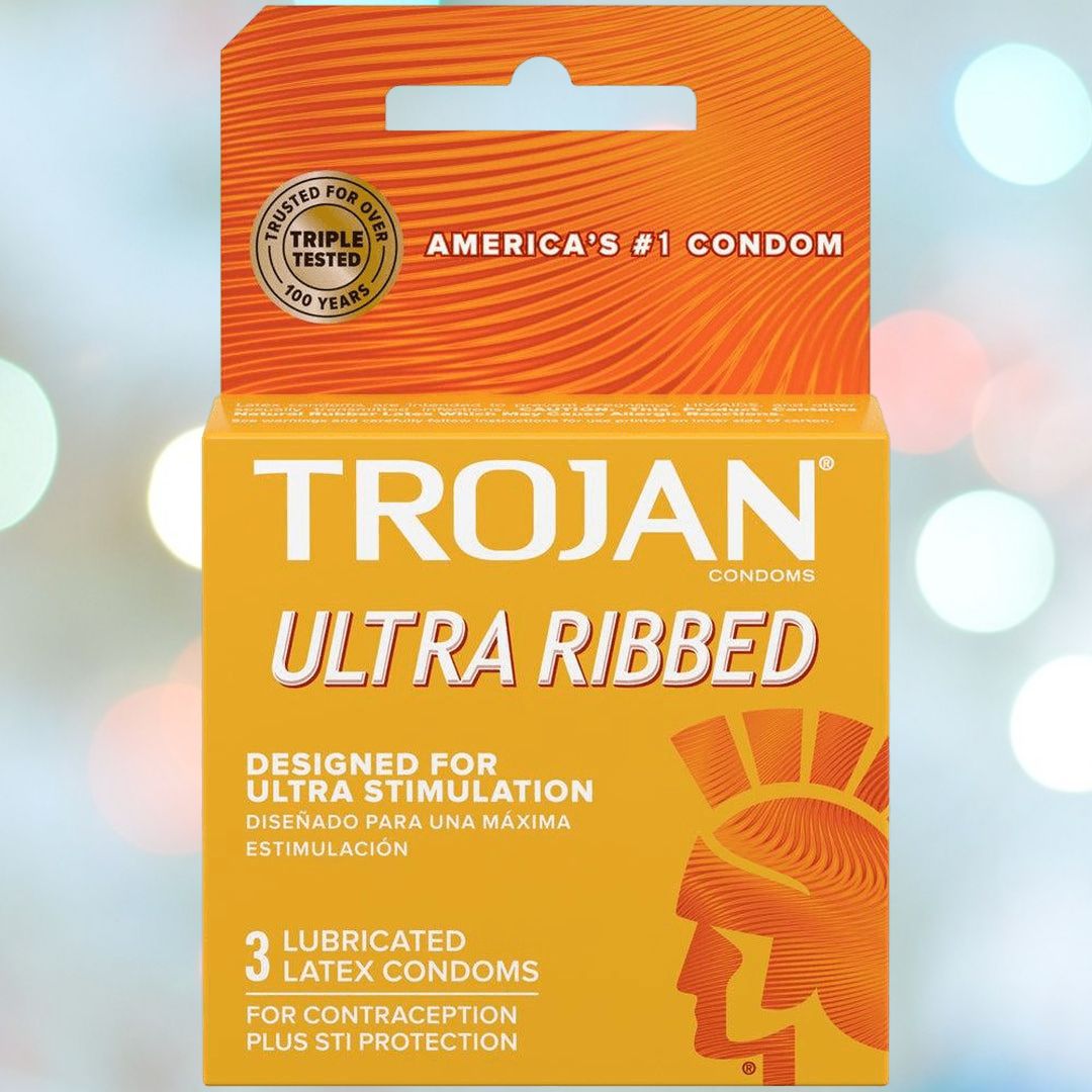 Image displaying an orange box of Trojan Ultra Ribbed Condoms by Trojan, highlighting it as America's top choice for ultra stimulation. The package includes 3 lubricated latex condoms designed for reliable contraception and STI prevention.