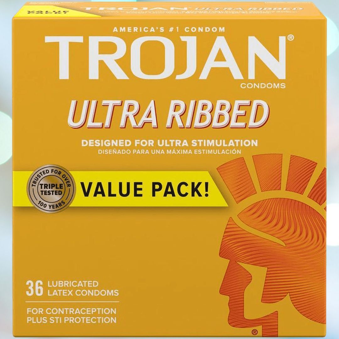 A yellow package of Trojan Ultra Ribbed Condoms, featuring the term "Value Pack," includes 36 lubricated latex condoms crafted for enhanced stimulation. Providing contraception and STI protection, the packaging prominently features the iconic Trojan helmet emblem.