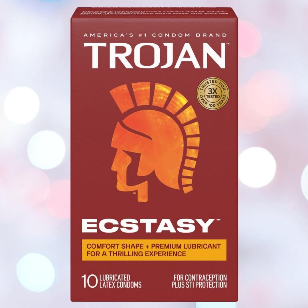A red box of Trojan Ultra Ribbed Ecstasy Condoms by Trojan, featuring a gold helmet logo. It offers a comfort shape, premium lubricant, and contains 10 lubricated condoms for contraception and STI protection.