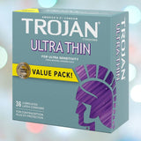 The image depicts a box of Trojan Ultra Thin Lubricated Condoms. The packaging is mainly turquoise, featuring a purple Trojan helmet logo. It is labeled "Ultra Thin for Ultra Sensitivity" and "Value Pack," containing 36 lubricated latex condoms designed for contraception and STI protection, offering enhanced sensitivity and a natural feeling.