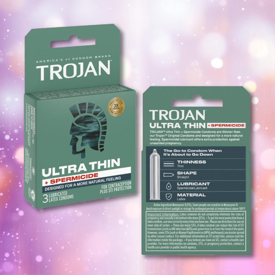 A box and packet of Trojan Ultra Thin Armor Condoms with Spermicide by Trojan are displayed on a soft, pastel background. The packaging highlights ultra thin condoms with spermicide for enhanced protection and sensitivity.