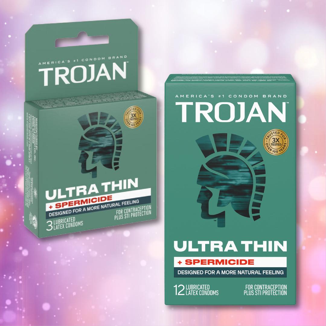 Two green boxes of Trojan Ultra Thin Armor Condoms with Spermicide—one single, one 12-pack—display the Trojan logo and highlight ultra thin latex for heightened sensitivity, added lubrication, and STI protection.