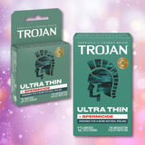 Two green boxes of Trojan Ultra Thin Armor Condoms with Spermicide—one single, one 12-pack—display the Trojan logo and highlight ultra thin latex for heightened sensitivity, added lubrication, and STI protection.