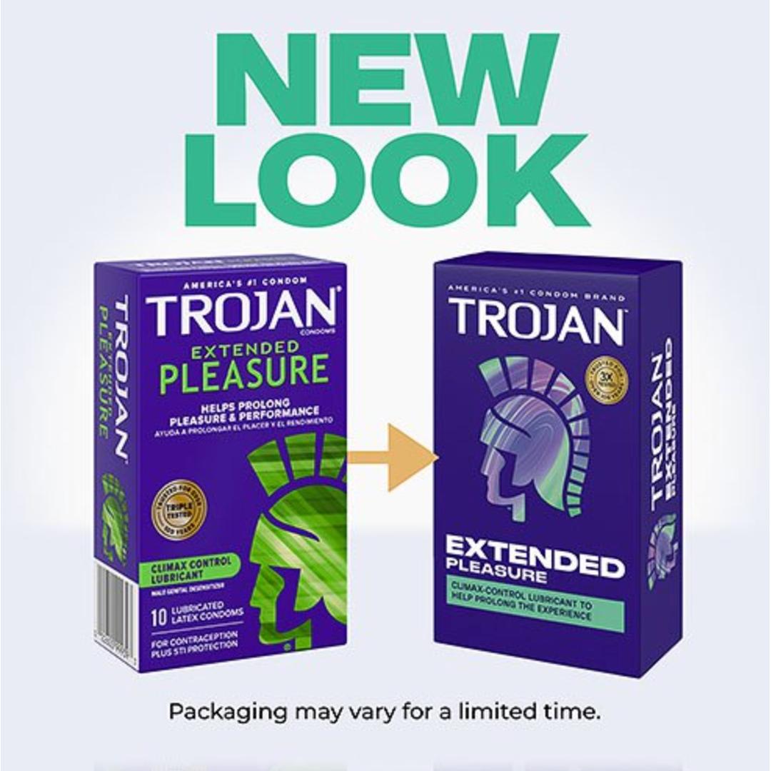 Two boxes of Trojan Extended Pleasure Climax Control Condoms by Trojan are shown side by side, displaying the updated packaging. A gold arrow highlights the new look, with condoms featuring a climax control lubricant to delay climax.