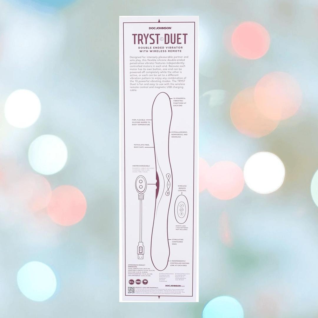 A product diagram and description for the Tryst Duet Double-Ended Silicone Vibrating Dildo with Wireless Remote - Berry by Doc Johnson, shown on a blurred pastel background, with text and illustrations highlighting its features and controls.