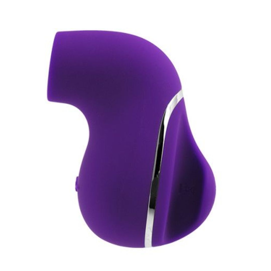 The VeDO Suki - Purple Air Suction Clit Stimulator by VeDO is a compact, purple, handheld device with a smooth, curved design and a small opening near the top. It is accented by a silver strip running along one side and features vibrating suction modes for versatile pleasure.